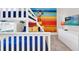 Fun bedroom featuring a bunk bed and a vibrant Mickey Mouse wall mural at 4058 Lana Avenue, Davenport, FL 33897