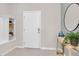 Bright foyer with built-in shelves, white front door, and decorative accents at 4058 Lana Avenue, Davenport, FL 33897