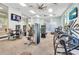 Well-lit gym featuring large windows and an array of modern exercise equipment at 4058 Lana Avenue, Davenport, FL 33897