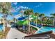 Community waterslides surrounded by tropical landscaping for a resort style pool experience at 4058 Lana Avenue, Davenport, FL 33897