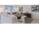 Living room featuring comfortable white sofa, stylish decor, and a patterned rug on tiled floor at 4212 Evernia Rd, Tavares, FL 32778