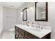 Bathroom with double vanity, marble countertops, and dark wood cabinets at 470 Manor Rd, Maitland, FL 32751