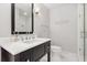 Elegant bathroom featuring a modern vanity with marble countertop and a glass-enclosed shower at 470 Manor Rd, Maitland, FL 32751