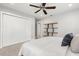 Modern bedroom with ceiling fan, built-in closet and floating shelves at 470 Manor Rd, Maitland, FL 32751