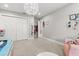 Bedroom with closet, decorative walls, and stylish, modern ceiling light fixture at 470 Manor Rd, Maitland, FL 32751