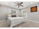 Bedroom featuring a comfy bed, neutral colors, and shuttered windows at 470 Manor Rd, Maitland, FL 32751