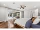 Main bedroom with wood floors, ceiling fan, and sliding doors to the outdoor patio at 470 Manor Rd, Maitland, FL 32751