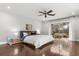 Main bedroom with wood floors, ceiling fan, and sliding doors to the outdoor patio at 470 Manor Rd, Maitland, FL 32751