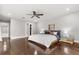 Main bedroom with wood floors, ceiling fan, and sliding doors to the outdoor patio at 470 Manor Rd, Maitland, FL 32751