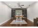 Home office featuring dark hardwood floors, built-in bookshelves, and ceiling fan at 470 Manor Rd, Maitland, FL 32751