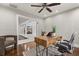 Bright home office with wood desk, patterned rug, and modern furnishings at 470 Manor Rd, Maitland, FL 32751