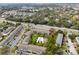 Aerial view of the property showcases its community layout, pool, landscaping, parking, and nearby roadways at 4705 S Texas Ave # 4705D, Orlando, FL 32839