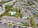 Overhead shot of condominium complex showcasing pool, parking, multiple units, and mature trees at 4705 S Texas Ave # 4705D, Orlando, FL 32839