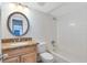 Bathroom with a granite countertop and white shower/tub at 4705 S Texas Ave # 4705D, Orlando, FL 32839