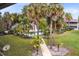 Community pool surrounded by lush landscaping and well-maintained green space, creating a serene environment at 4705 S Texas Ave # 4705D, Orlando, FL 32839