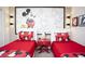 Mickey Mouse themed bedroom features two beds and playful decor at 4844 Romeo Cir, Kissimmee, FL 34746