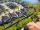 Aerial view of homes backing up to a large pond in the community at 5023 Southlawn Ave, Orlando, FL 32811