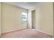 Cozy bedroom with neutral walls, carpeted floors, and a closet with sliding doors at 5023 Southlawn Ave, Orlando, FL 32811