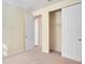 A secondary bedroom with carpet and a closet at 5023 Southlawn Ave, Orlando, FL 32811