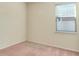 Bright bedroom with a window and soft carpet, perfect for relaxation and rest at 5023 Southlawn Ave, Orlando, FL 32811