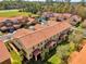 Aerial view of a residential area with many townhomes and landscaped lawns at 5150 Fiorella Ln, Sanford, FL 32771