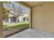 Relaxing covered back patio with a view of the lush green lawn and community area at 5150 Fiorella Ln, Sanford, FL 32771