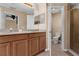 Bathroom featuring a dual vanity sink and walk-in shower at 5150 Fiorella Ln, Sanford, FL 32771