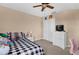 Bedroom with a bed, dresser, closet, and plush chair at 5150 Fiorella Ln, Sanford, FL 32771