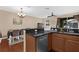 The kitchen seamlessly blends into the dining area, which creates an open floorplan with sleek appliances at 5150 Fiorella Ln, Sanford, FL 32771