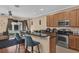 Well-equipped kitchen featuring stainless steel appliances, a breakfast bar, and seamless access to the living area at 5150 Fiorella Ln, Sanford, FL 32771