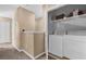 Convenient laundry area with washer, dryer, and overhead storage space at 5150 Fiorella Ln, Sanford, FL 32771