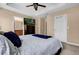 Main bedroom with large bed, TV, and en-suite bathroom at 5150 Fiorella Ln, Sanford, FL 32771