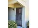 Close-up of front door with visible unit number, complemented by neat landscaping at 5505 Hernandes Dr # 125, Orlando, FL 32808