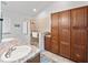 Well-lit bathroom featuring a walk-in shower, ample storage, and a granite-top vanity at 629 Nighthawk Cir, Winter Springs, FL 32708