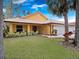 Inviting home exterior with lush green lawn and landscaping, highlighting its curb appeal at 629 Nighthawk Cir, Winter Springs, FL 32708