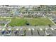 Aerial view of neighborhood showcasing community layout with playground, solar, and streetscape at 630 Citrus Isle Blvd, Davenport, FL 33837