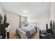 Neutral bedroom with carpet, a metal bed frame, a window, and a side desk at 630 Citrus Isle Blvd, Davenport, FL 33837