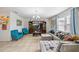 Bright living room with tile floors, a large sectional sofa, and a media center with a flatscreen TV at 630 Citrus Isle Blvd, Davenport, FL 33837