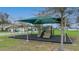 Community playground offering a shaded play area with swings and slides, perfect for outdoor activities at 630 Citrus Isle Blvd, Davenport, FL 33837