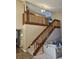 Inviting staircase with wood banister, carpeted steps, and views of the living area at 6630 Abeydon Ct, Orlando, FL 32818