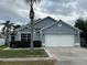 Charming single-story home featuring a two-car garage and well-maintained front yard at 636 Bohannon Blvd, Orlando, FL 32824