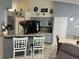 Kitchen with gray cabinets, stainless steel appliances, and granite countertops at 636 Bohannon Blvd, Orlando, FL 32824