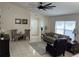 Inviting living room with tile floors, neutral tones, and a large window for ample natural light at 636 Bohannon Blvd, Orlando, FL 32824