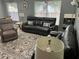 Inviting living room featuring stylish rug, large windows, and comfortable seating arrangement at 636 Bohannon Blvd, Orlando, FL 32824