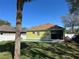 Backyard of a home with a green exterior and a swimming pool at 1008 Magnolia Blossom Ct, Apopka, FL 32712