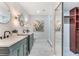 Modern main bathroom featuring dual sinks, decorative lighting, and a walk-in shower at 1055 Kensington Park Dr # 111, Altamonte Springs, FL 32714