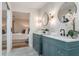 Bright bathroom featuring dual vanities, modern fixtures, and a serene view into the bedroom at 1055 Kensington Park Dr # 111, Altamonte Springs, FL 32714