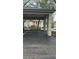 Assigned carport parking offers convenience and protection, surrounded by well-maintained landscaping at 1055 Kensington Park Dr # 111, Altamonte Springs, FL 32714