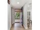Bright condo entryway with wood flooring and a view of the sunny outdoor patio at 1055 Kensington Park Dr # 111, Altamonte Springs, FL 32714