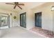 Inviting condo entryway with a brick-paved welcome mat, ceiling fan, and views of the outdoors at 1055 Kensington Park Dr # 111, Altamonte Springs, FL 32714